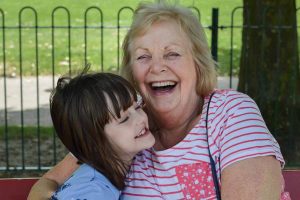 Grandmother and granddaughter hug