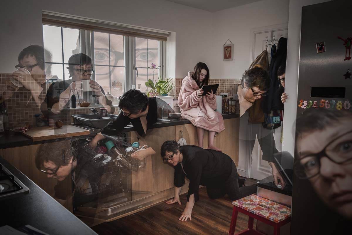durham photographer wins contest image of photographer in many different places in a kitchen with daughter sat in the middle behind the scenes